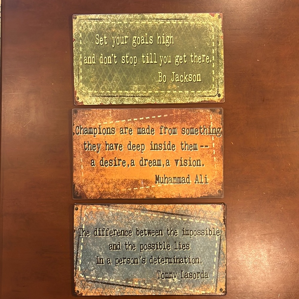 Metal inspirational wall signs.